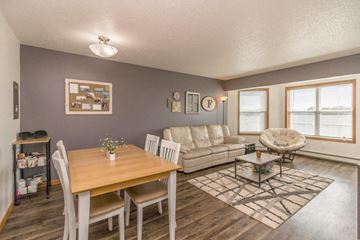 Bismarck apartment for rent - a living room and dining room with a couch and a table