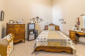 Little Falls apartment for rent - a bedroom with a bed and a dresser and other furniture