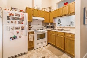 Little Falls apartment for rent - a kitchen with white appliances and wooden cabinets