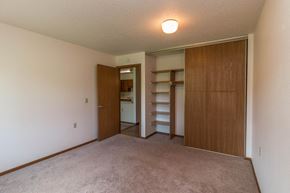 Milaca apartment for rent - a bedroom with a closet and a door to a bathroom