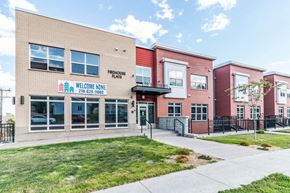 Duluth apartment for rent - the front of a building with a sidewalk and grass