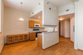 Grafton apartment for rent - an empty kitchen with wood flooring and white walls