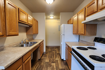 Jamestown apartment for rent - a kitchen with a stove sink and refrigerator