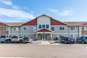 Bismarck apartment for rent - a large building with cars parked in front of it