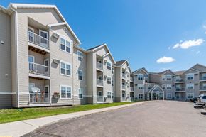 Bismarck apartment for rent - an empty street with an apartment building on the side