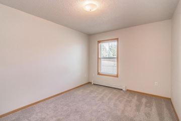 Bismarck apartment for rent - the spacious living room with carpet and a window