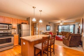 Elk River apartment for rent - a kitchen with a center island and a living room