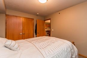 Elk River apartment for rent - a bedroom with a large bed and a closet