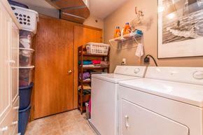 Elk River apartment for rent - a washer and dryer in a laundry room with a closet