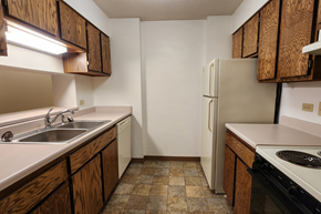 Jamestown apartment for rent - an empty kitchen with a sink and a refrigerator