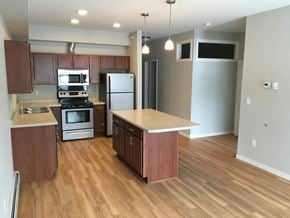 Jamestown apartment for rent - a kitchen with wooden floors and stainless steel appliances