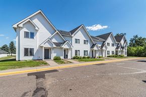 North Branch apartment for rent - a row of white houses on the side of a street
