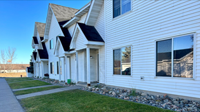 North Branch apartment for rent - a white house with a sidewalk in front of it