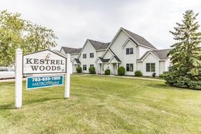Buffalo townhouse for rent - the estates sign in front of a house