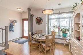 Mandan apartment for rent - a dining room with a table and chairs and a window
