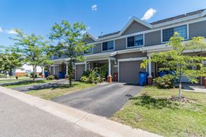 Cambridge apartment for rent - a house with a driveway and trees in front of it