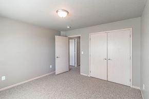 Cambridge apartment for rent - an empty bedroom with a closet and a door to the bathroom