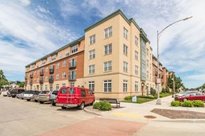 Mandan apartment for rent - a red van parked in front of an apartment building
