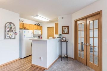 Mandan apartment for rent - a kitchen with a counter top and a refrigerator