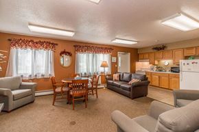 Waconia apartment for rent - a living room with couches and chairs and a table