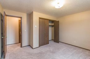 Dickinson apartment for rent - an empty bedroom with two doors and a closet