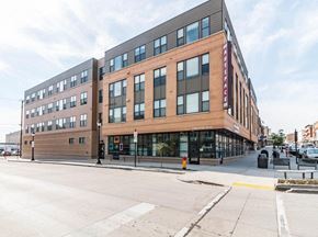 Minot apartment for rent - a large brick building on the corner of a street