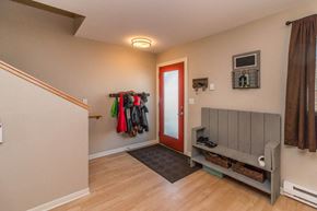 Minot apartment for rent - the entrance to a house with a closet and a red door