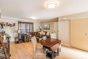 Minot apartment for rent - a living room and dining room with a table and chairs