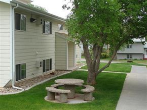Hot Springs apartment for rent - a group of stone picnic tables sitting in the grass