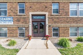Devils Lake apartment for rent - the front of a brick building with a sidewalk in front