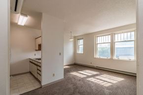 Devils Lake apartment for rent - the living room and kitchen of an empty apartment