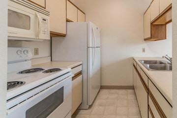 Devils Lake apartment for rent - a kitchen with white appliances and a white refrigerator