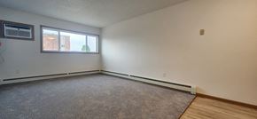 Devils Lake apartment for rent - the living room of an empty house with a large window