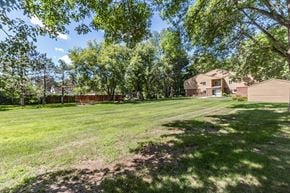 Princeton apartment for rent - a large yard with trees and a house in the background