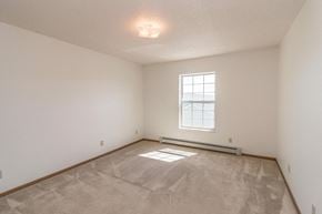 Bismarck apartment for rent - the spacious living room with white walls and a window