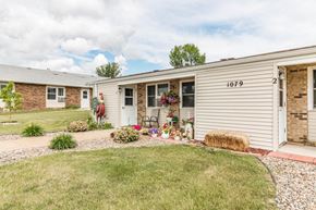 Dickinson apartment for rent - a small white and brick house with a yard and grass