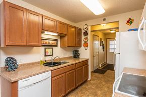 West Fargo townhouse for rent - a kitchen with a sink and a refrigerator