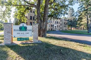Little Falls apartment for rent - A sign for Riverwood Pines with a phone number on it.