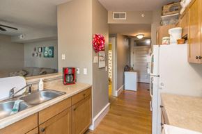Little Falls apartment for rent - A kitchen with a sink, a refrigerator, and a counter.