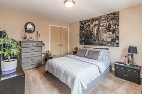 Minneapolis apartment for rent - a bedroom with a bed and a dresser
