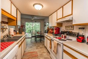 Faribault apartment for rent - a kitchen with a stove top oven and a sink