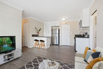 Los Angeles apartment for rent - A living room with a television and a bar area.