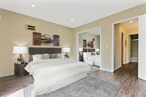 Los Angeles apartment for rent - A bedroom with a large bed and a painting on the wall.