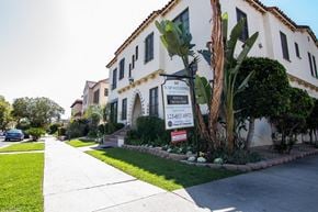 Los Angeles apartment for rent - A sign for S.P.Aulding Estate Agents is in front of a white building.