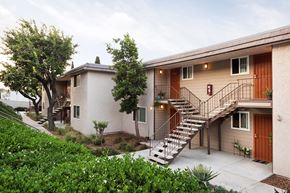 San Diego apartment for rent - an apartment building with stairs and a stairway to a balcony