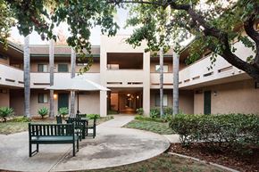 San Diego apartment for rent - a courtyard with benches in front of a building