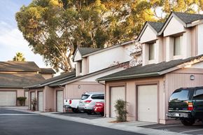 San Diego apartment for rent - a row of houses with cars parked in front of them