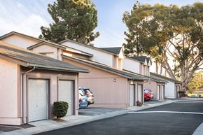 San Diego apartment for rent - a row of buildings with cars parked in front of them