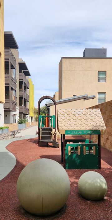 San Diego apartment for rent - A playground with a slide and two large balls.