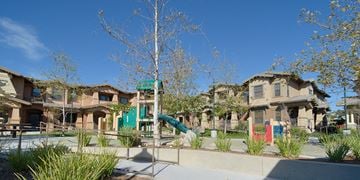 Poway apartment for rent - a group of houses with a playground and a slide